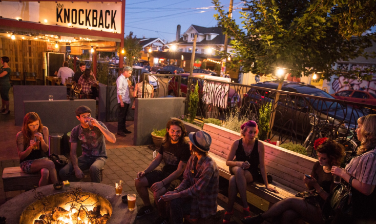 Patrons enjoy a firepit at The Knockback