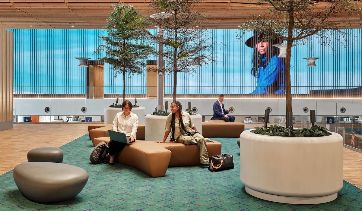 Travelers sit and enjoy the comforts of PDX